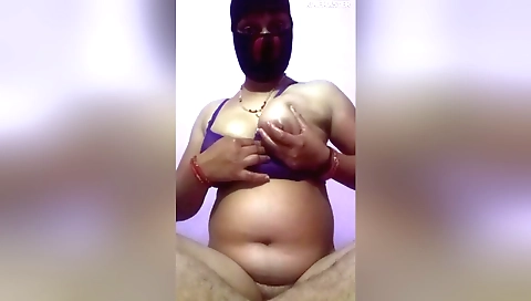 Indian chick is sucking her hairy pussy and masturbating