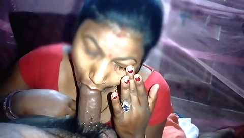 Indian brunette is eating a large cock in her mouth