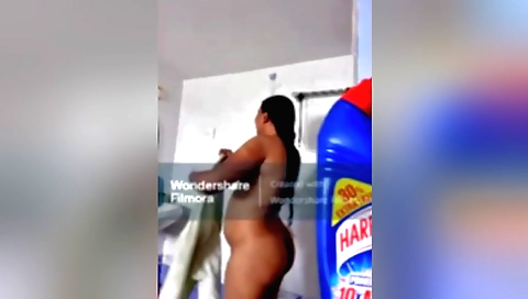 Indian brunette in white blouse and skirt changing