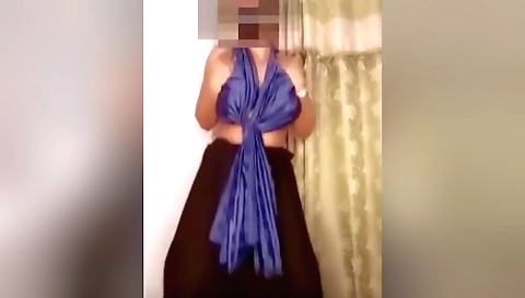 Solo naked dancing in a backyard with a naked figure