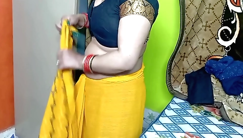 Indian girl in yellow color Sari does it in bedroom
