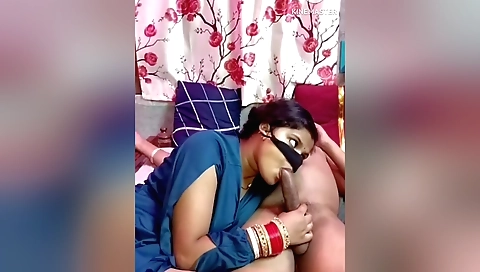 Indian woman gives a blowjob while husband is riding her