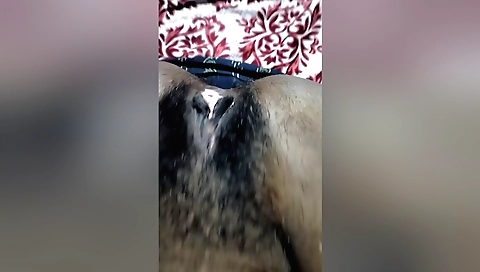 Indian girl with natural hairy pussy plays with her body