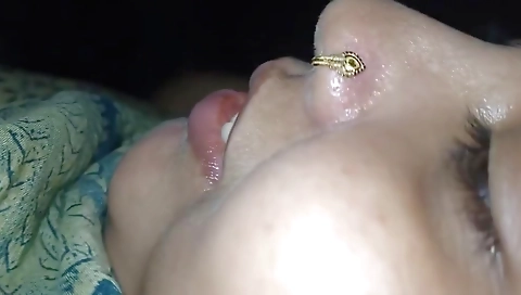 Indian woman is having sex with her husband in a bedroom