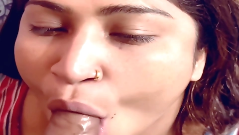 Indian girl is sucking a man's dick with a blowjob