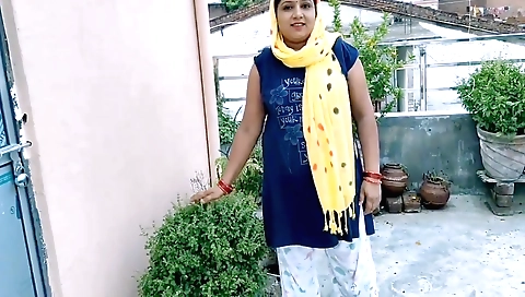 A beautiful girl gets wet on her body during a outdoor party
