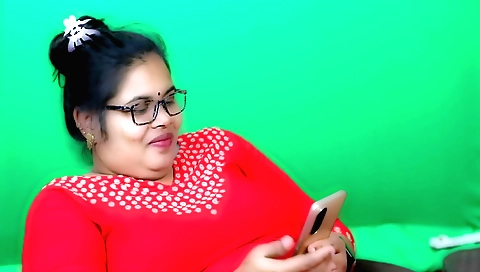 Busty brunette in red dress and glasses is playing with fingers