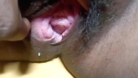 Hairy solo female masturbates and sticks a dildo inside